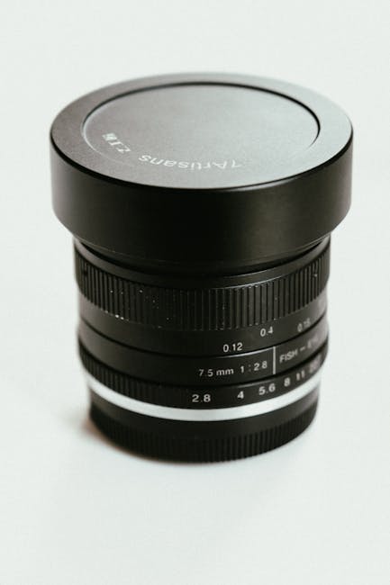 High-end camera lens representing professional equipment and liability insurance